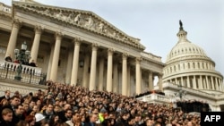 A crowd gathers on the East Steps of the House of Representatives on January 10 for a national moment of silence in honor of the victims of the shootings in Arizona.