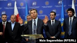 Georgian Dream leader Bidzina Ivanishvili (center) presents his nominees for a new cabinet of ministers, in Tbilisi on October 8.