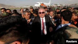 Afghan Vice President Abdul Rashid Dostum arrives at the airport in Kabul in July.