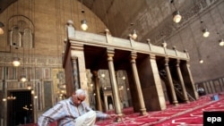 A worker prepares the inside of Cairo's 14th-century Sultan Hassan Mosque, which U.S. President Barack Obama will visit on the Egyptian leg of his trip on June 4.