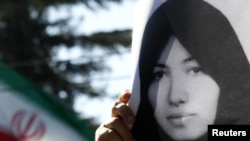 A demonstrator holds a picture of Sakineh Mohammadi Ashtiani at a protest in front of the Iranian Embassy in Rome earlier this month.