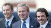 U.S./U.K.: Bush, Blair Signal Debt Deal, Reaffirm Iraq Commitment