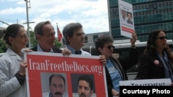 Protesters at the United Nations participate in one of the global vigils held for Arash and Kamiar Alaei.