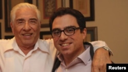 Iranian-American consultant Siamak Namazi (right) is pictured with his father, Baquer Namazi, in an undated photo.