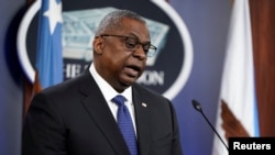 U.S. Defense Secretary Lloyd Austin talks to reporters in Washington on January 28.