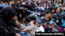 Kazakh police detain people in a square in the center of Almaty on June 9.