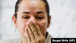 Presidential candidate Svyatlana Tsikhanouskaya reacts during a news conference in Minsk on August 10, after the Belarusian presidential election.