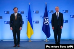 Ukrainian Foreign Minister Dmytro Kuleba (left) and NATO Secretary-General Jens Stoltenberg prior to a meeting at NATO headquarters in Brussels on April 13