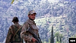 Pakistani Army soldiers stand guard in the Swat Valley.