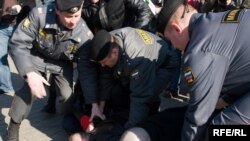 Russian police dealing with a Moscow protest against the falsified regional elections.