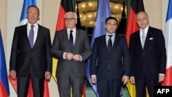 Russian Foreign Minister Sergei Lavrov, German Foreign Minister Frank-Walter Steinmeier, Ukrainian Foreign Minister Pavlo Klimkin and France's Foreign Minister Laurent Fabius ahead of their meeting in Berlin.