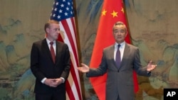 Chinese Foreign Minister Wang Yi (right) with U.S. national-security adviser Jake Sullivan in Beijing on August 27. 