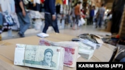 The value of one U.S. dollar is now reportedly worth more than 20),000 rials on the street market. (file photo)