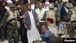 Egyptian Army soldiers restrain a supporter of President Hosni Mubarak near Tahrir Square.