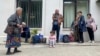 Local residents gather near a municipal government building after reports of shooting in Stepanakert, Nagorno-Karabakh, on September 21.