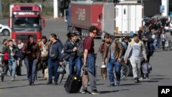 Russians cross the border at Verkhny Lars between Georgia and Russia in Georgia on September 27, 2022, shortly after Russian President Vladimir Putin announced the first partial mobilization of reservists for the war in Ukraine.