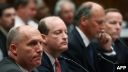 Transocean, BP America, and Halliburton executives (left to right) appeared before Congress on May 12 for a "ridiculous spectacle," according to President Obama.