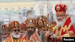 Patriarch Kirill (right) leads a call to prayer in support of the Russian Orthodox Church at Christ the Savior Cathedral in Moscow.