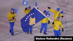 Albin Tahiri of Kosovo carries the national flag during the opening ceremony of the Pyeongchang 2018 Winter Olympic Games at the Pyeongchang Stadium on February 9.