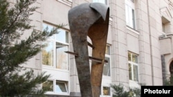 A statue symbolizing the national currency, the dram, outside the Central Bank building in Yerevan.