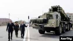 President Ilham Aliyev views armaments for a military unit in Naxcivan in 2014. RFE/RL's Azerbaijani Service has recently been allowed back to report from the isolated exclave.