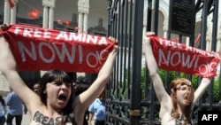 Activists from the women's movement Femen demonstrate in Tunis on May 29. They shouted "Free Amina," in reference to the young Tunisian woman imprisoned for protesting against hard-line Islamists and awaiting trial for illegally possessing pepper spray.