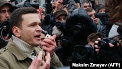 Russian opposition politician Ilya Yashin speaks during a banned rally in Moscow on December 24.