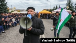 People gather to protest against what they say was an unfair land swap deal with the neighboring Russian region of Chechnya, in Ingushetia's capital, Magas.