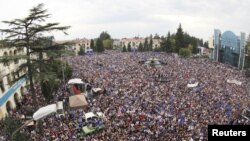 Thousands of people attend an election rally in support of the opposition bloc Georgian Dream in Zugdidi on September 22. 