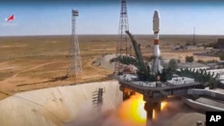 A Russian Soyuz rocket lifts off from the Baikonur Cosmodrome in Kazakhstan on August 9, carrying an Iranian Khayyam satellite into orbit.