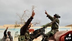 Rebels in Ras Lanuf celebrate on March 5 the taking of that port city from Qaddafi forces one day earlier.