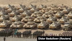 Russian, Kazakh, and Belarusian service members line up during military drills carried out by the Russia-led Collective Security Treaty Organization at the Harb-Maidon training ground near the Tajik-Afghan border in October.