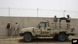 Iranian border guards stand at their country's frontier with Iran in the village of Milak. (file photo)