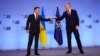 Ukrainian President Volodymyr Zelenskiy (left) and NATO Secretary-General Jens Stoltenberg in Brussels on December 16.