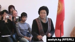 President Roza Otunbaeva casts her ballot in Bishkek. "We are prepared to face any challenges," she says.