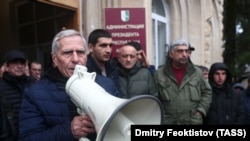 Opposition activists protest outside the de facto parliament of the separatist Georgian entity Abkhazia on January 10. 