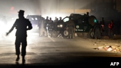 Afghan police officers work at the scene of an attack on foreign troops in Kabul in October.