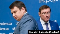 A highly controversial bill would have seen Artem Sytnyk (left) removed as the head of Ukraine's anticorruption bureau following a complaint from Prosecutor-General Yuriy Lutsenko (right) that the organization had exceeded its authority. (file photo)