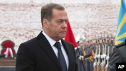 Former Russian President Dmitry Medvedev takes part in a wreath-laying ceremony at the Tomb of the Unknown Soldier on Defender of the Fatherland Day in Moscow on February 23. 