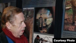 The former Czechoslovak and Czech president in an undated photo at a "Chechnya: The Final Solution" photo exhibition at the library in Prague devoted to Havel, a staunch champion of human rights throughout his lifetime.