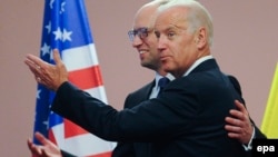 U.S. Vice President Joe Biden (right) meets with Ukrainian Prime Minister Arseniy Yatsenyuk in Kyiv on June 7.