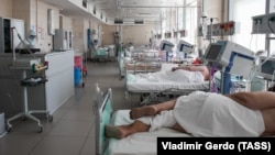 Patients lie in bed at a Moscow Hospital treating people suffering from COVID-19 on June 23.