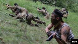 Pro-Russian gunmen from the "Vostok Battalion" participate in a military exercise near Donetsk on June 1.