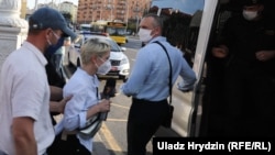 RFE/RL correspondent Alyaksandra Dynko was detained while covering a picket in Minsk on June 19.