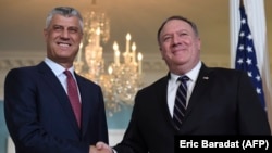 U.S. Secretary of State Mike Pompeo (right) with Kosovar President Hashim Thaci in Washington on November 26.