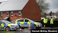 British police guard the home of former Russian intelligence officer Sergei Skripal in Salisbury.