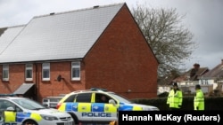 Police officers guarding the cordoned-off area around the home of former Russian intelligence officer Sergei Skripal on April 3.