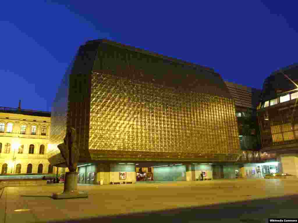 Prague&#39;s New Stage theater, an extension of the stately National Theater of 1881, was designed by Karel Prager, a top architect from the communist era. Completed in 1983, its exterior of opaque glass blocks has famously been described as resembling frozen urine.