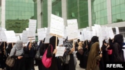 Women in Kabul protest in Kabul against plans for legislative changes curbing protections.