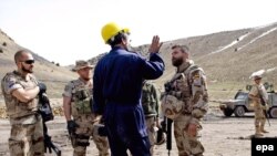 Spanish soldiers of NATO's International Security Assistance Force (ISAF) visit a coal-mining camp in Herat in March.